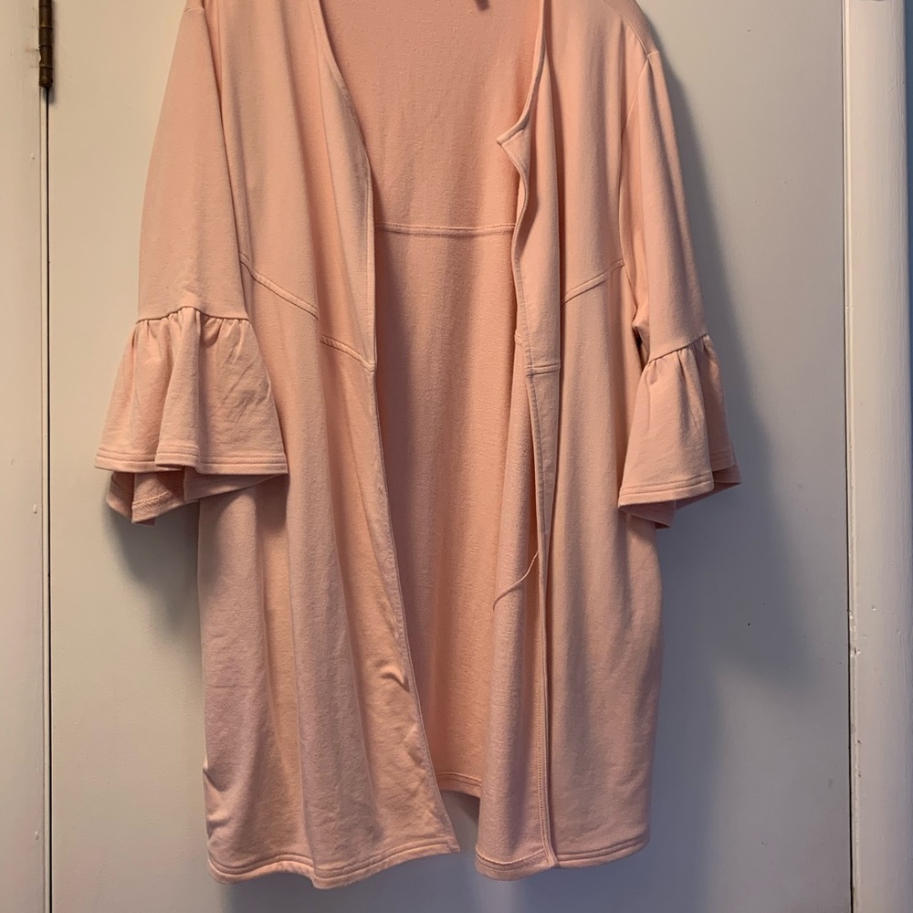 Soft ruffle sleeved open cardigan.